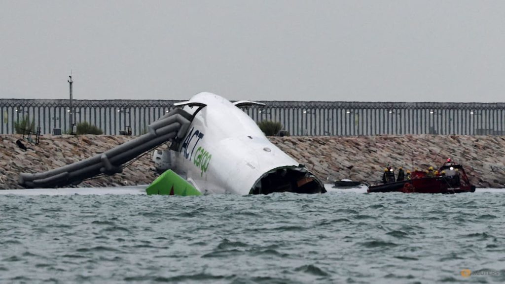 Cargo plane slides off runway in Hong Kong, airport operator says