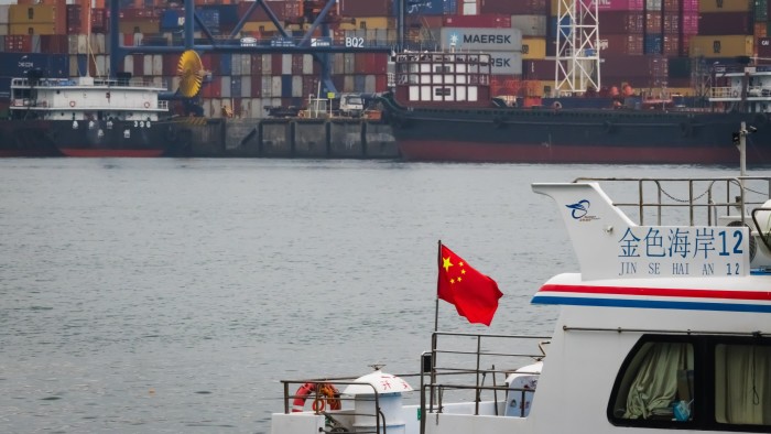 China opens probe into Qualcomm and imposes retaliatory fees on US ships